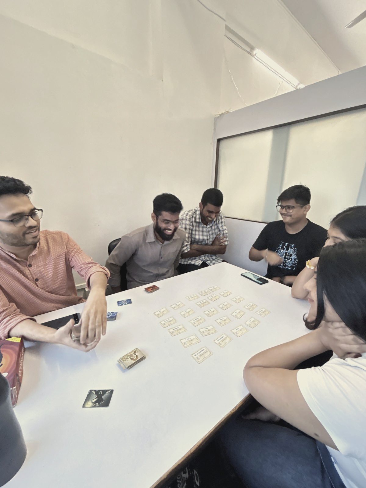 The team playing a board game at the office